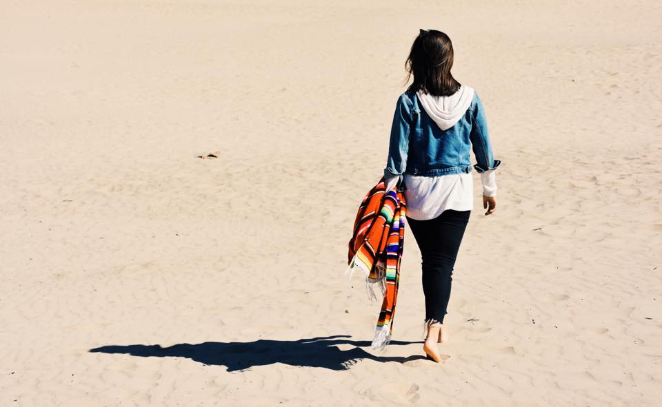 Girl At The Beach Walking With Blanket