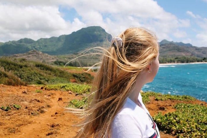 charlotte reader landscape ocean hair blowing nature travel adventure sunny?width=698&height=466&fit=crop&auto=webp