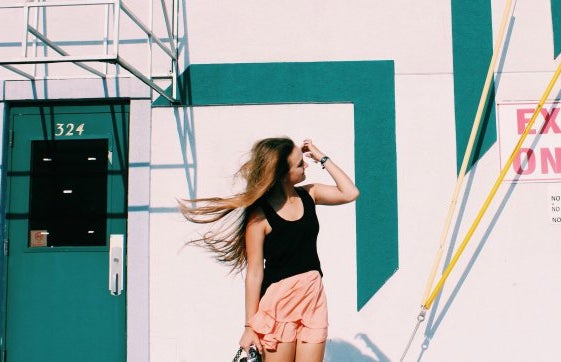 Anna Schultz windblown hair in front of cool wall?width=719&height=464&fit=crop&auto=webp