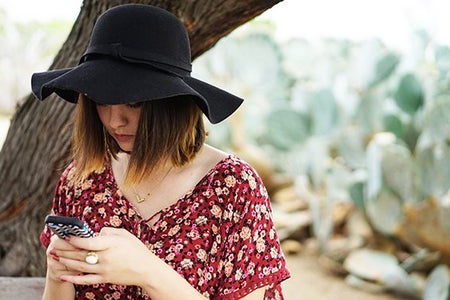 Kellyn Simpkin-Texting Hat Girl Cactus Bench Floral Shirt
