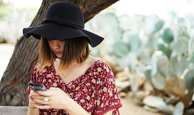 Kellyn Simpkin-Texting Hat Girl Cactus Bench Floral Shirt