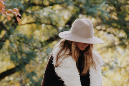 Girl Looking Down In Fuzzy Coat