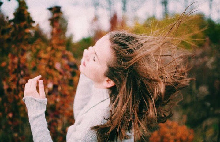 Girl With Hair Blowing In The Wind Fall