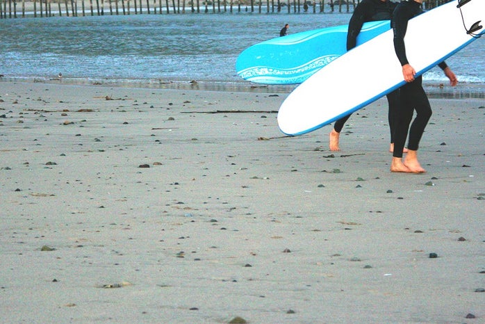 the lala two surfers with surf boards?width=698&height=466&fit=crop&auto=webp