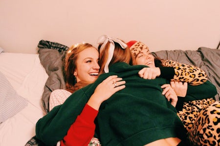 Anna Schultz-Friends Cuddling In Holiday Pajamas