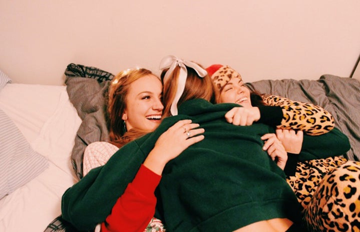 Anna Schultz friends cuddling in holiday pajamas?width=719&height=464&fit=crop&auto=webp