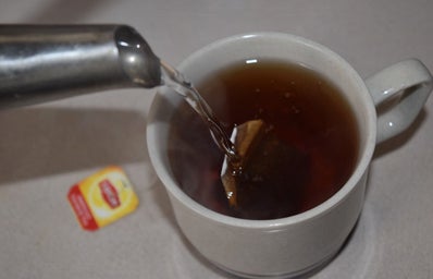 Hot Tea Pouring Water