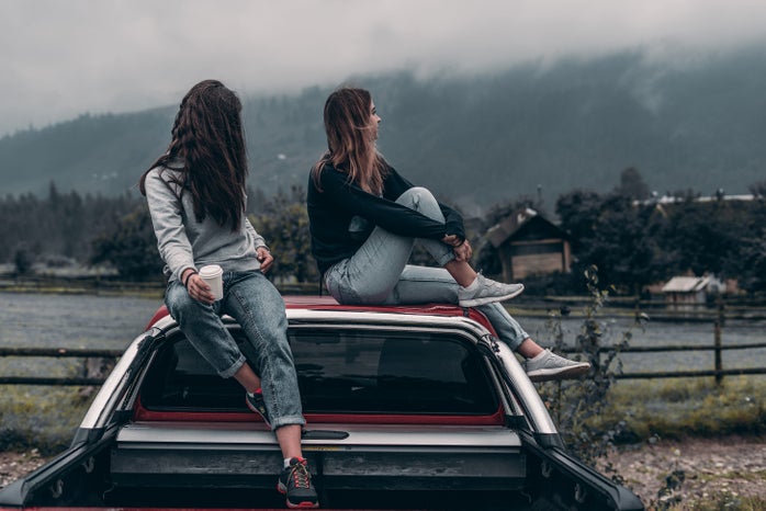 Two Women Sitting On Vehicle Roofs 2409681?width=698&height=466&fit=crop&auto=webp