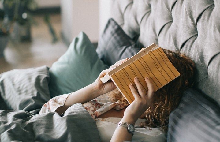 Woman Covering Face With Book On Bed 1524232?width=719&height=464&fit=crop&auto=webp