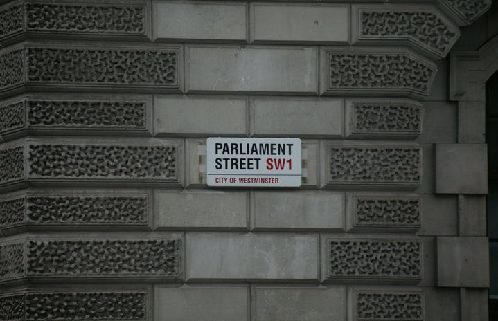 gray building with white Parliament Street signage photo