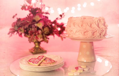 pink icing cake on cake stand valentines