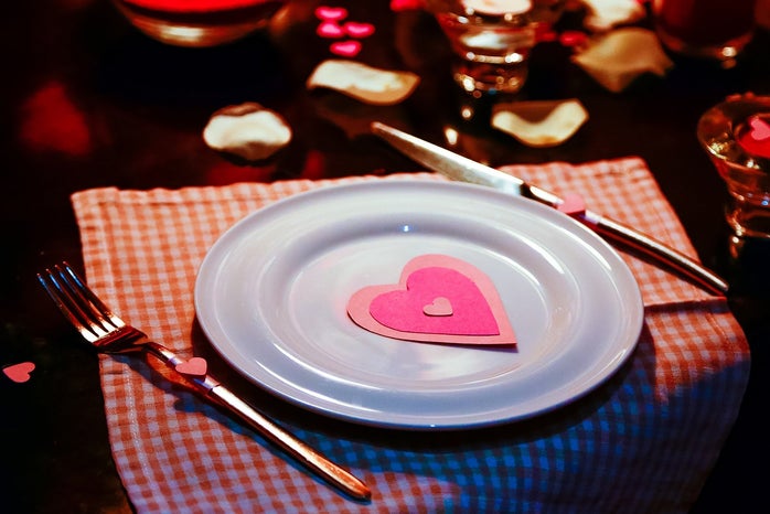 Plate on a fancy table with Valentine's Day decorations