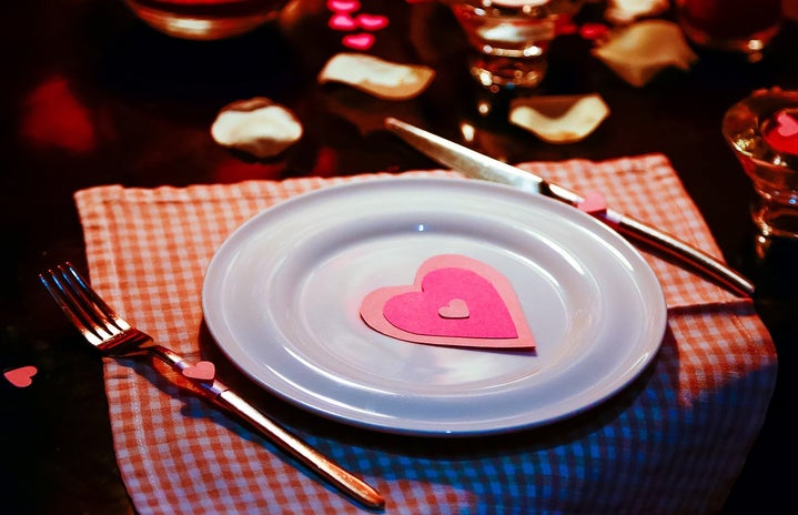 Plate on a fancy table with Valentine\'s Day decorations