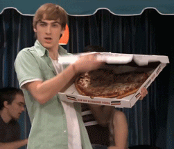 Gif of man holding heart shaped pizza