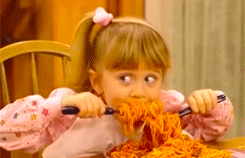 Gif of Michelle from Full House eating a plate of spaghetti