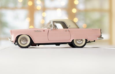 pink toy car in bright setting