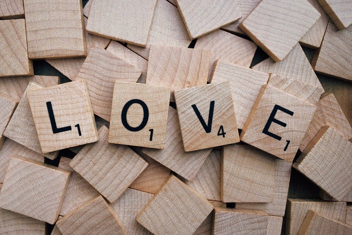 LOVE spelled out with scrabble letter tiles