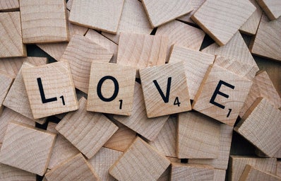 LOVE spelled out with scrabble letter tiles