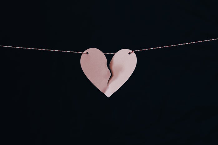 broken heart on a string with black background