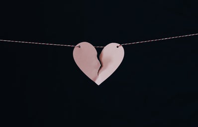 broken heart on a string with black background