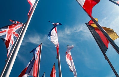 assorted nation\'s flags against the sky