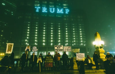protestors at night outside of trump tower