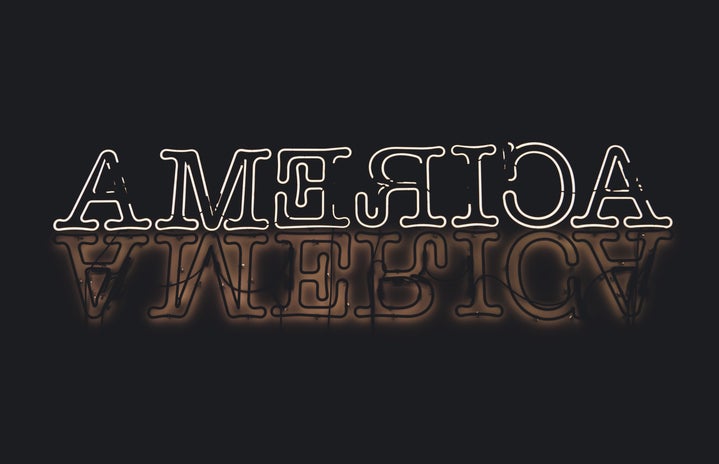 America neon sign against black backdrop?width=719&height=464&fit=crop&auto=webp