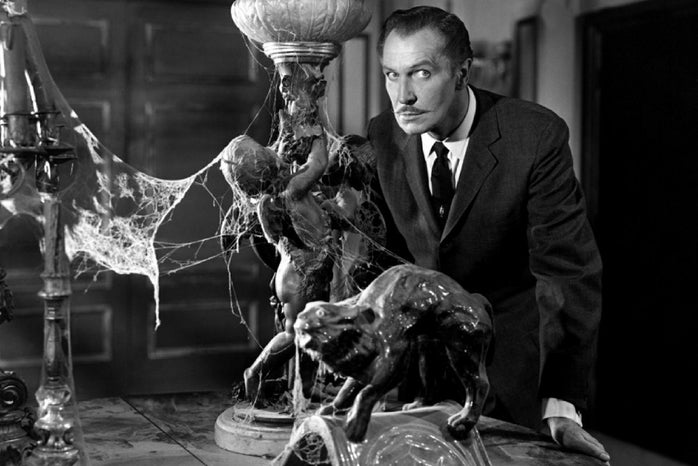 A black and white photo of Vincent Price next to a table of vintage objects covered in exaggerated cobwebs