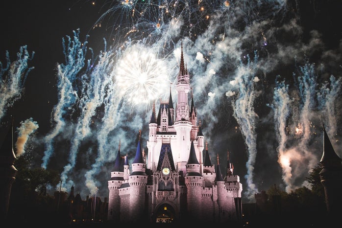 Disneyland's Sleeping Beauty Castle amid a nighttime fireworks show