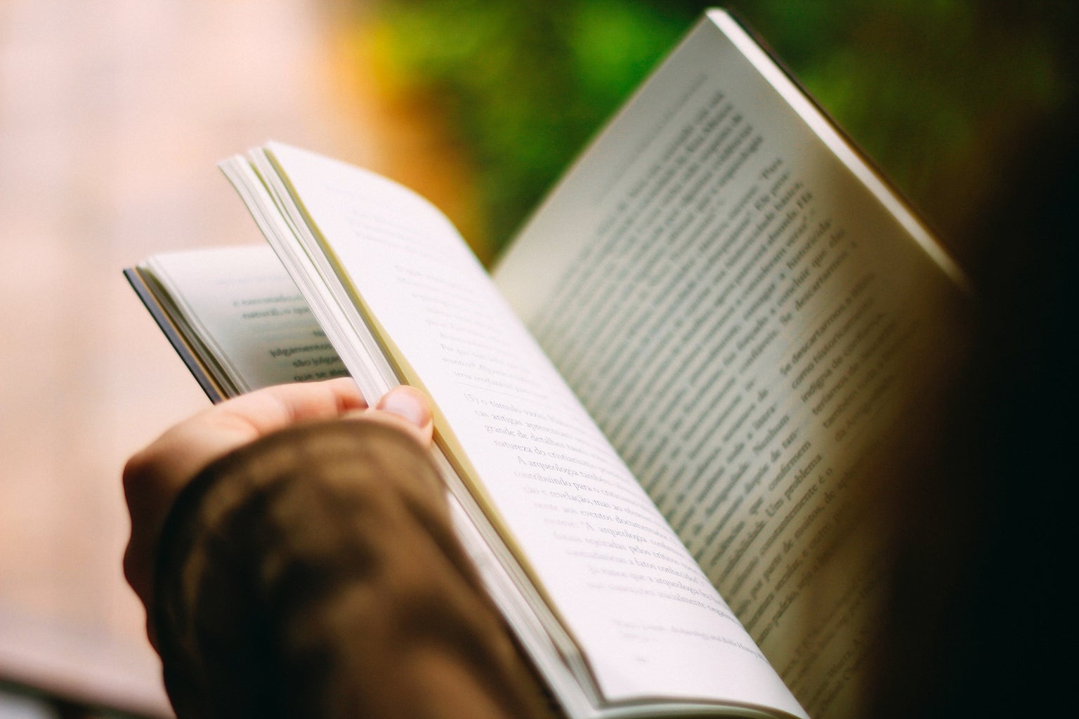 Person holding book open