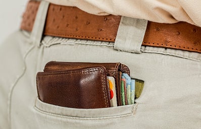 wallet peaking out back pocket with credit cards
