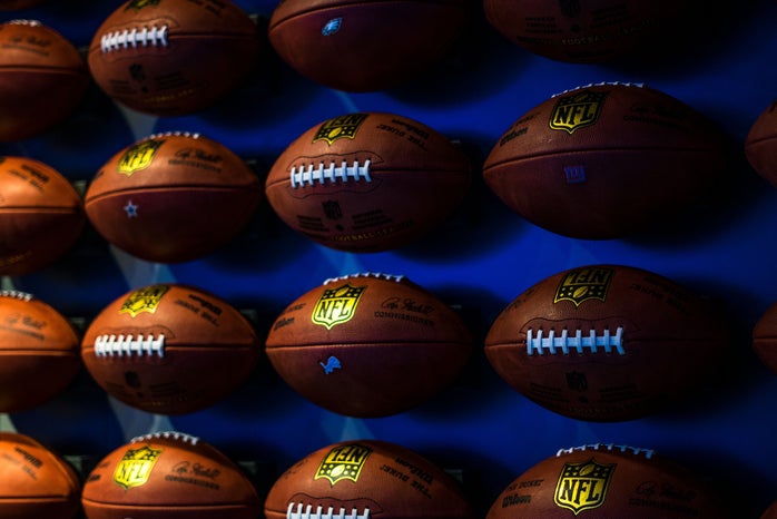 Rows of footballs on a wall