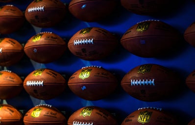 Rows of footballs on a wall