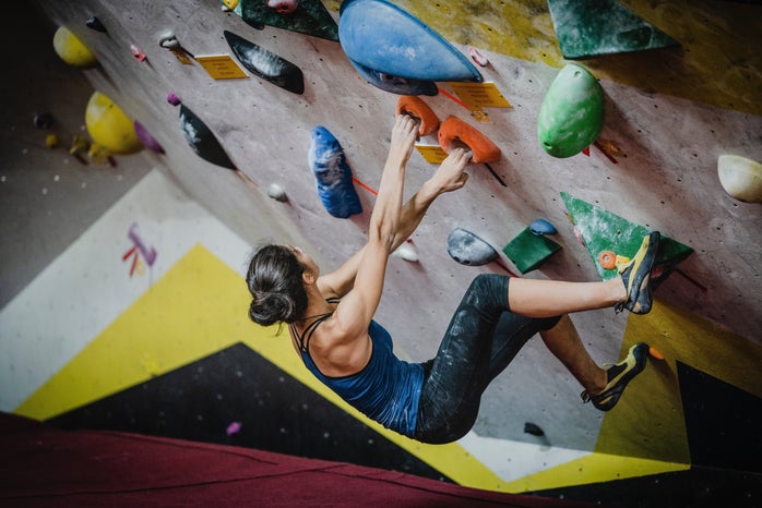 woman on rock climbing wall