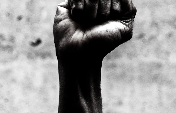 Black and white photo of a fist in the air