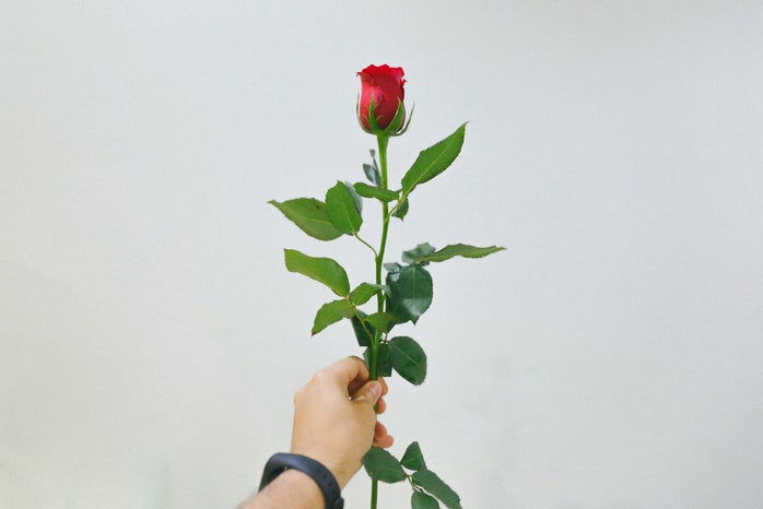 man holding rose
