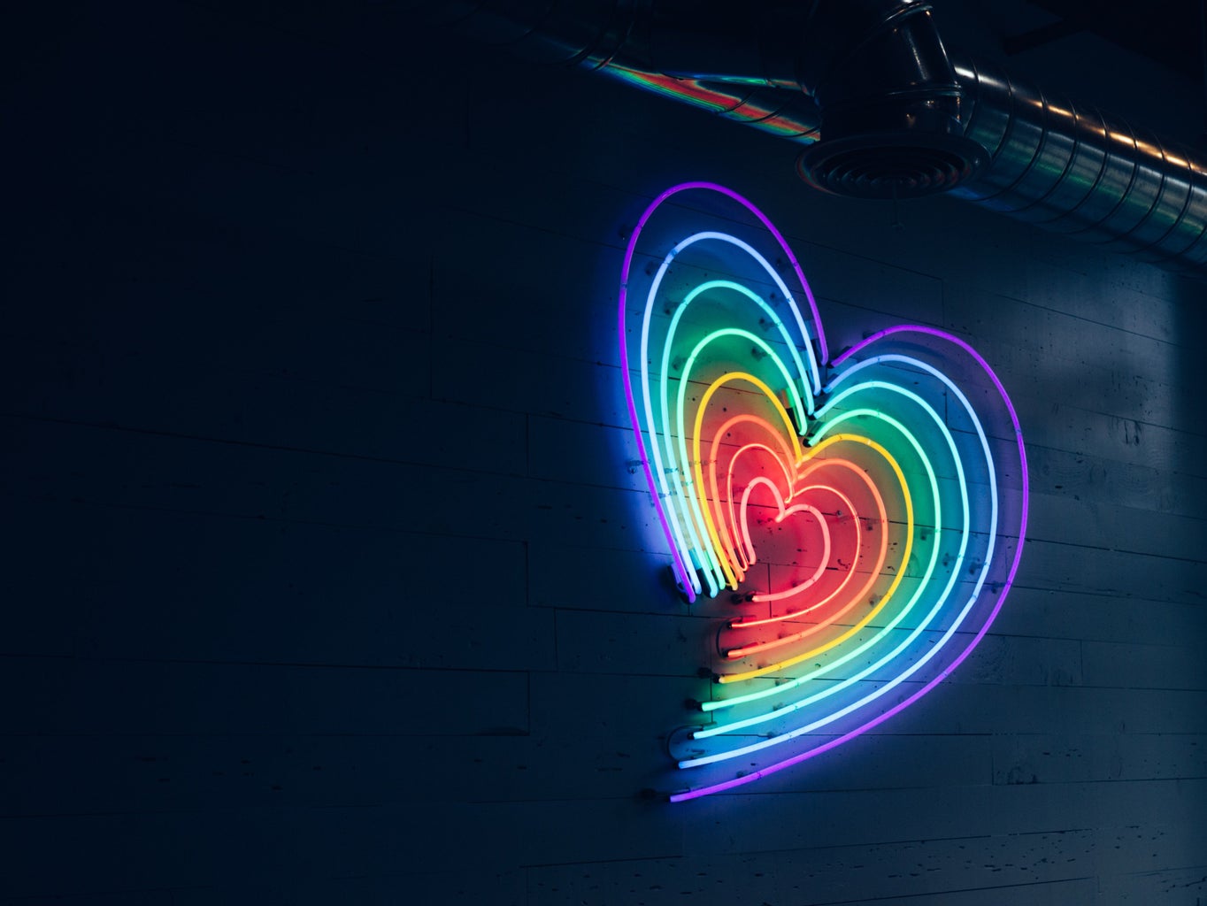 multicolored LED heart on wall