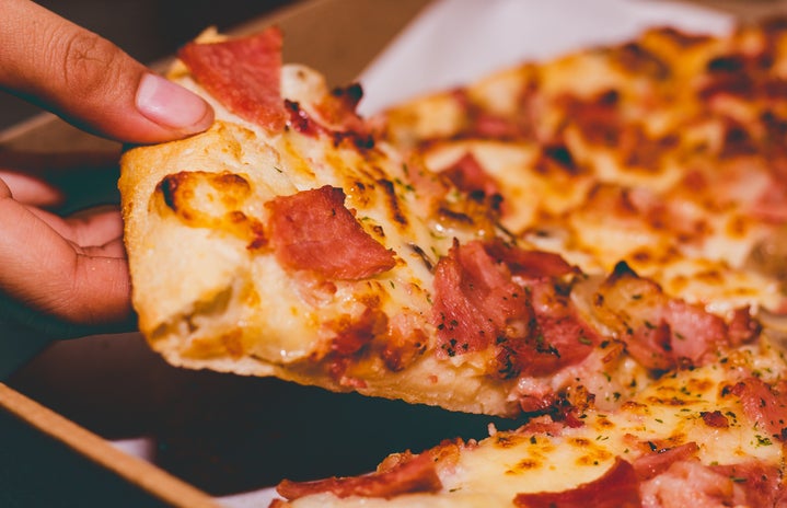 pizza slice pulling from whole pizza