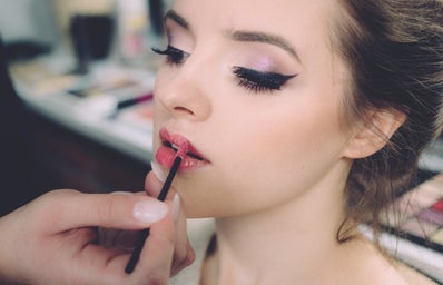 girl getting makeup done