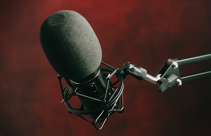 microphone in fromnt of misty red and black background