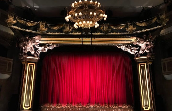 Red curtain in big theatre