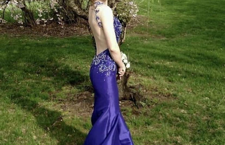 Woman in prom dress outdoors