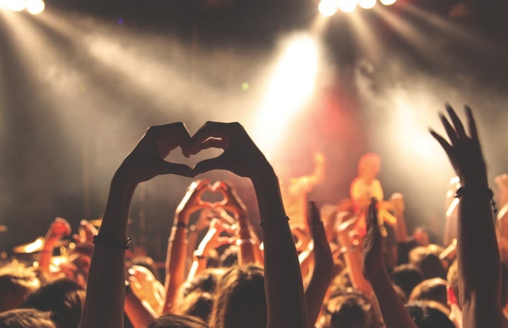 Hand heart at a concert