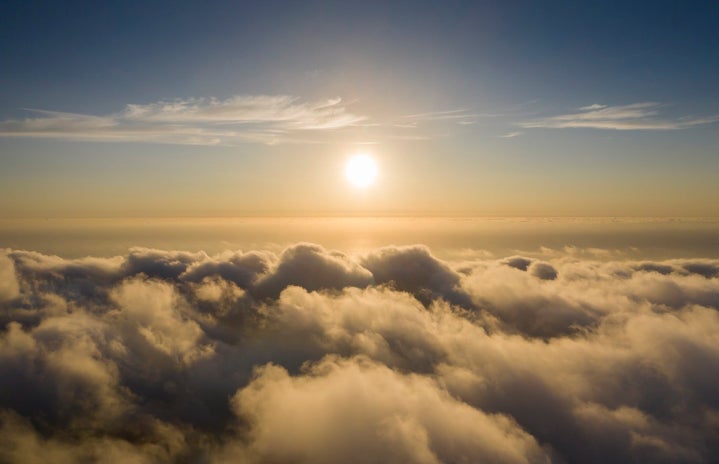 A bird\'s eye view of beautiful clouds and the sun
