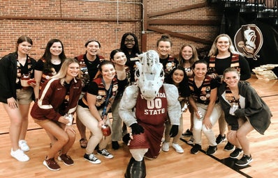 woman with friends at a basketball game