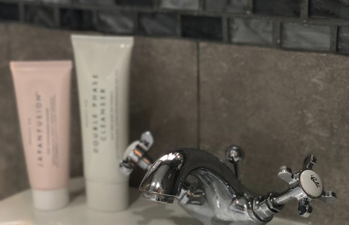 skincare products on sink counter