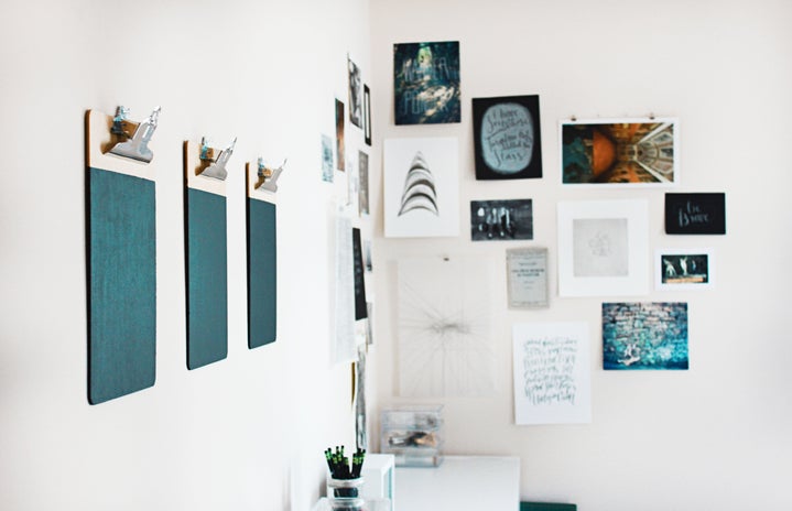 a gallery wall of small art pieces