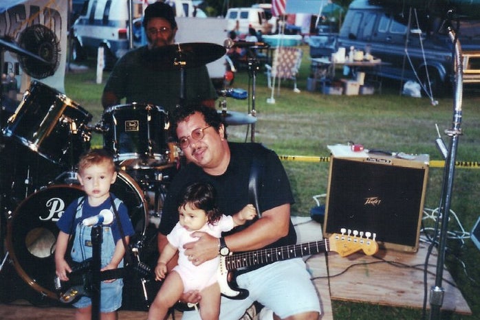 father with little kids on stage 2