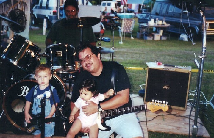 father with little kids on stage 2