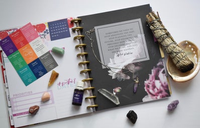 A sage smudge stick and a planner